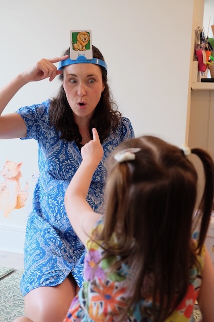 Sarah playing headbands with a little girl